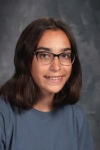 student with glasses and blue top