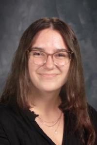 student with glasses and long hair