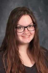 student with long hair on the shoulders