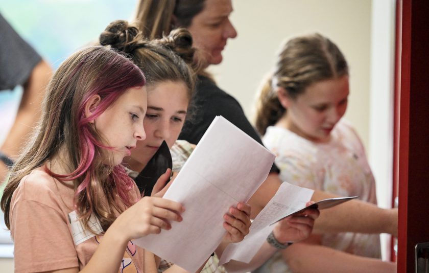 students comparing schedules in the hallway