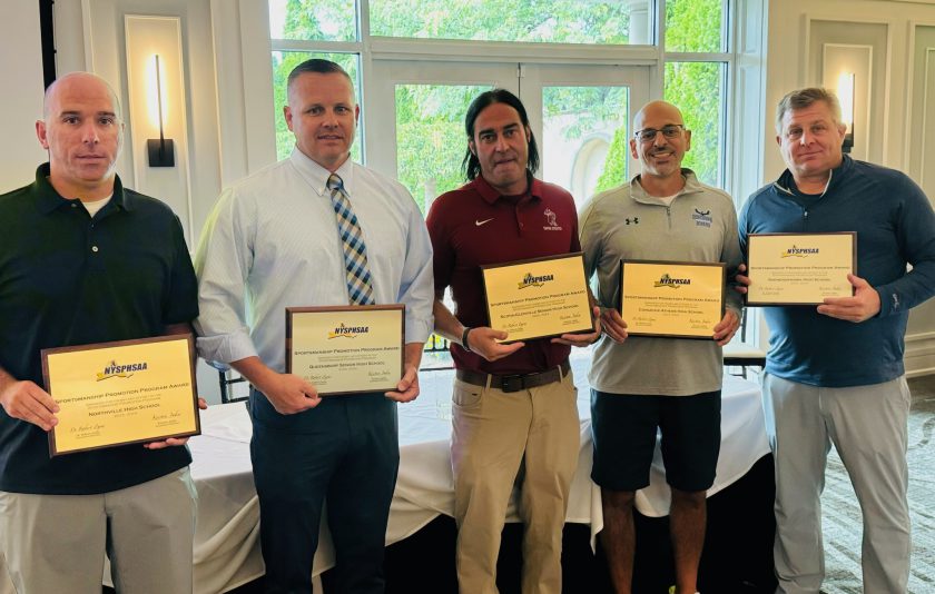 five athletic directors holding up awards