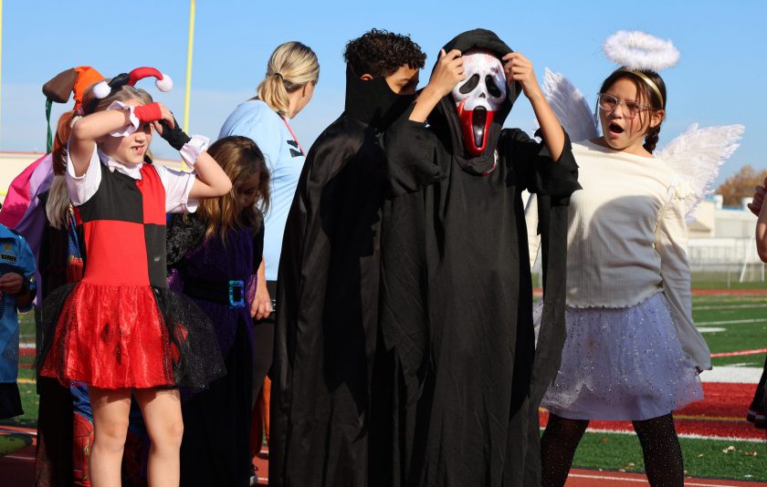 masked and halloween dressed students