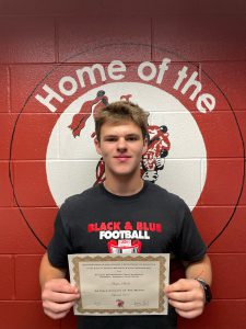 student holds certificate proudly