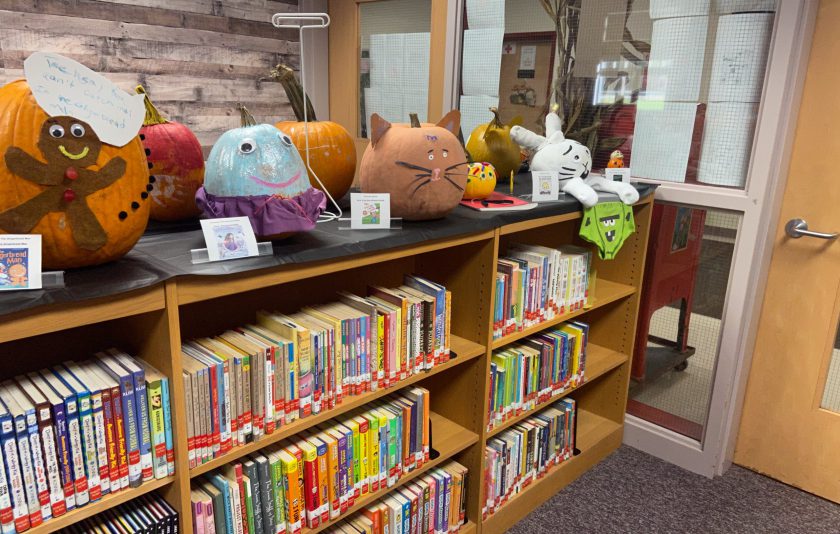 pumpkins on bookshelves