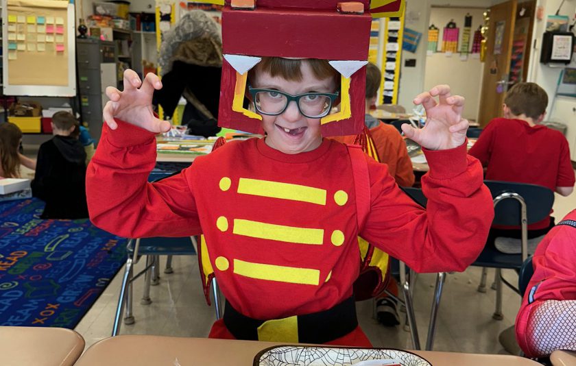 kid in red robot costume