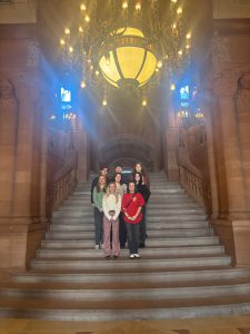 students standing on the million dollar staircase at the state capital