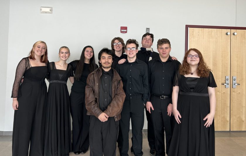 Nine student musicians dressed in black