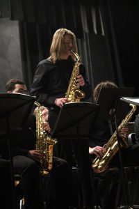 student plays sax