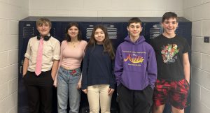 students standing in front of lockers